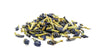 A pile of dried butterfly pea flowers on a white background.